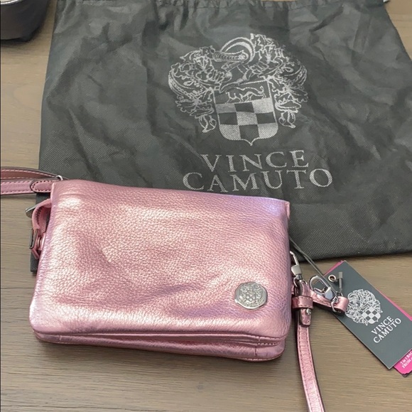 Vince Camuto Handbags - NWT. Vince Camuto metallic pink clutch/wristlet